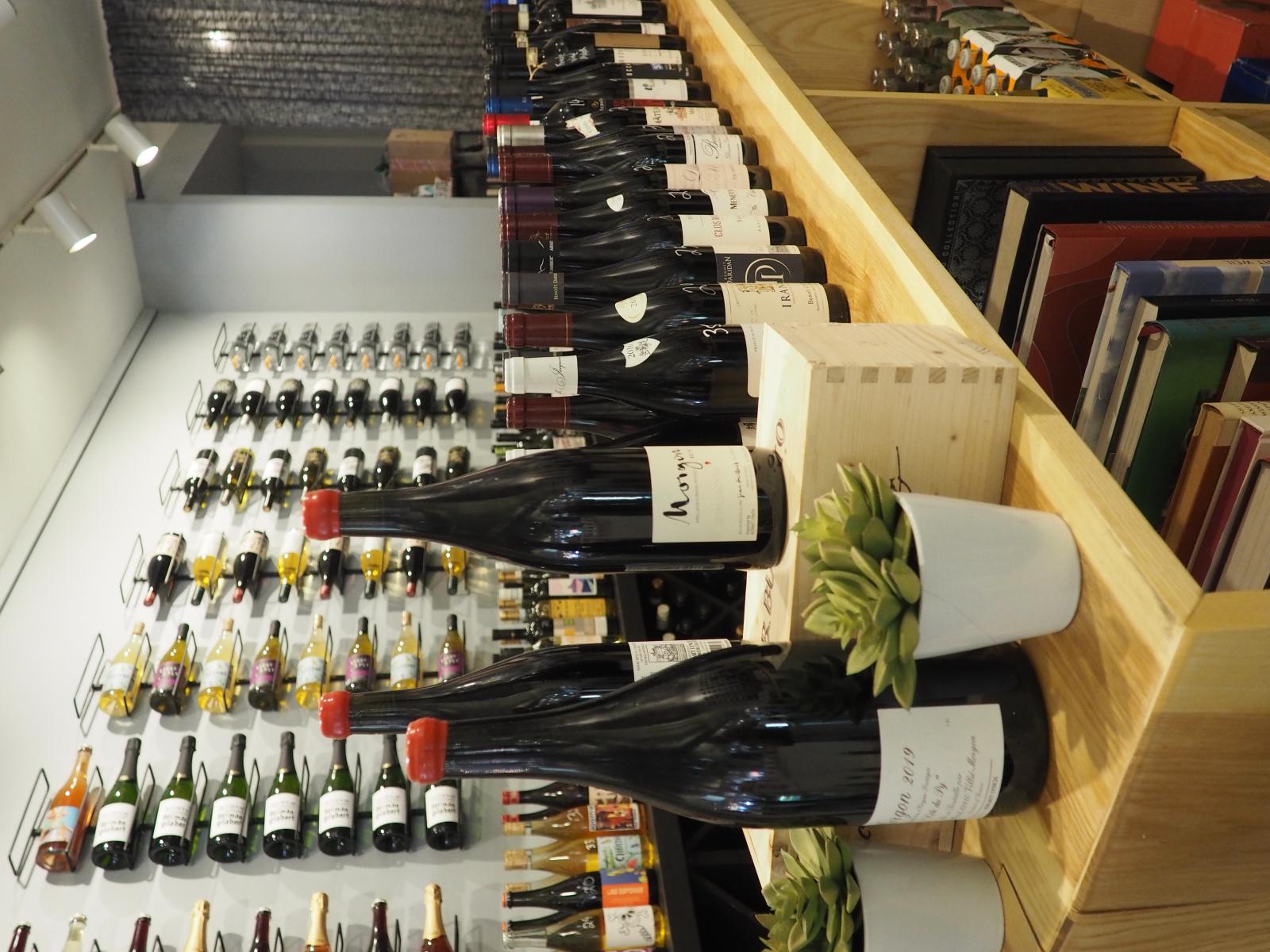 Photo of bottles on shelves inside Vitis Wines